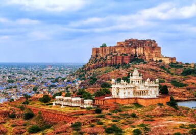 Panorama view of the blue city of Jodhpur, Rajasthan, India, with Mehrangharh Fort and Jaswant Thada mausoleum