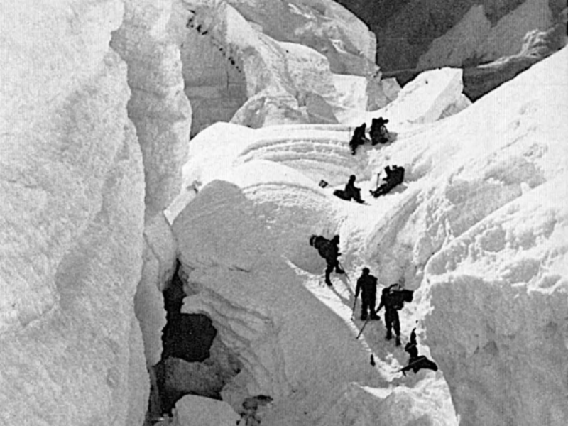 Swiss climbers navigating the Khumbu Icefall between Camp I and Camp II during the First Lhotse Expedition in 1956.