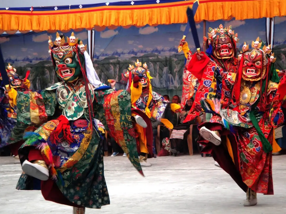 Mani Rimdu Festival mask dance performed by Buddhist monks in traditional colorful costumes at Tengboche Monastery, Solukhumbhu, Nepal