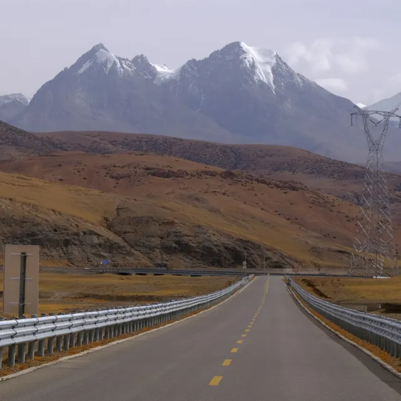 Mountain road from Kerung to Saga with snow peaks and open landscape
