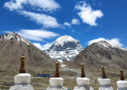 White chortens at Zuthulpuk with Mount Kailash rising in the background under a clear blue Himalayan sky.