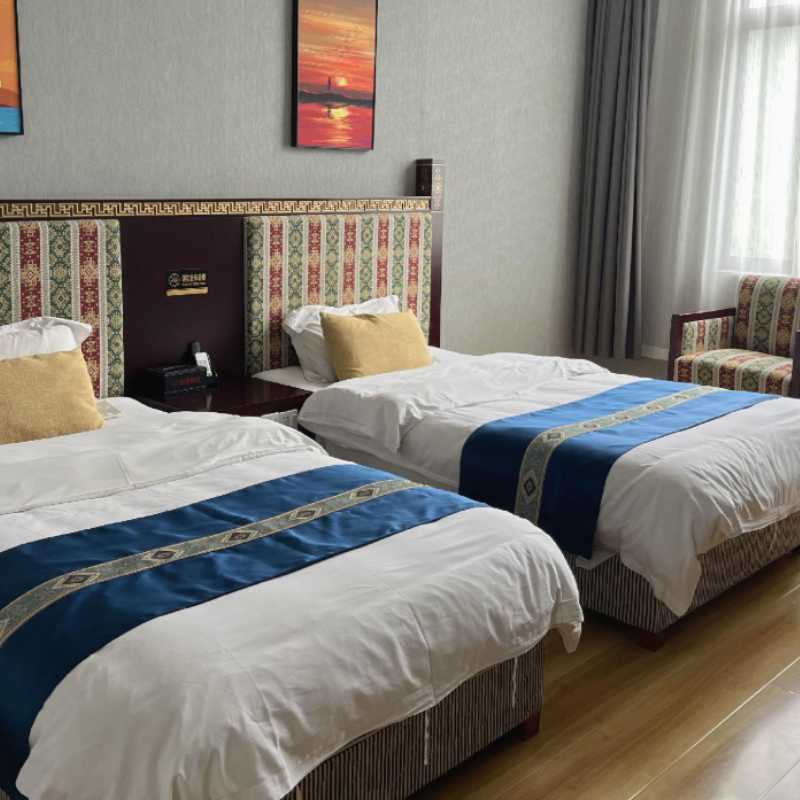 Comfortable twin-bed room at Shell Xizang Rikaze Jilong Hotel in Kerung, Tibet.