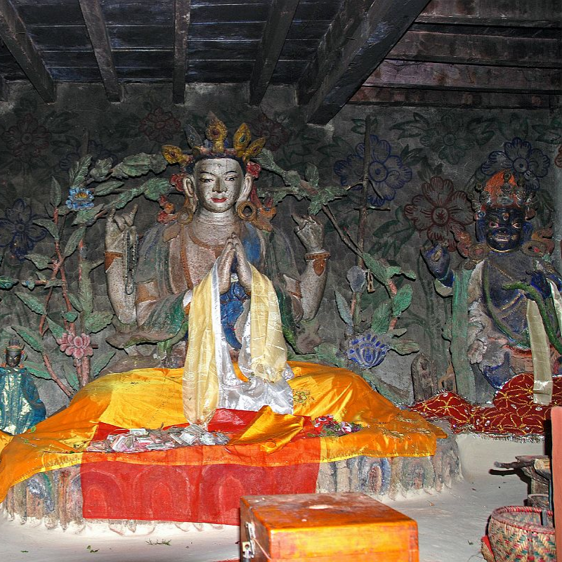 Ancient Buddhist statues and sacred figures inside Jwala Mai temple in Mustang