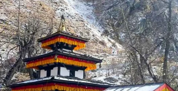 Muktinath temple complex surrounded by snowy hills during spring season