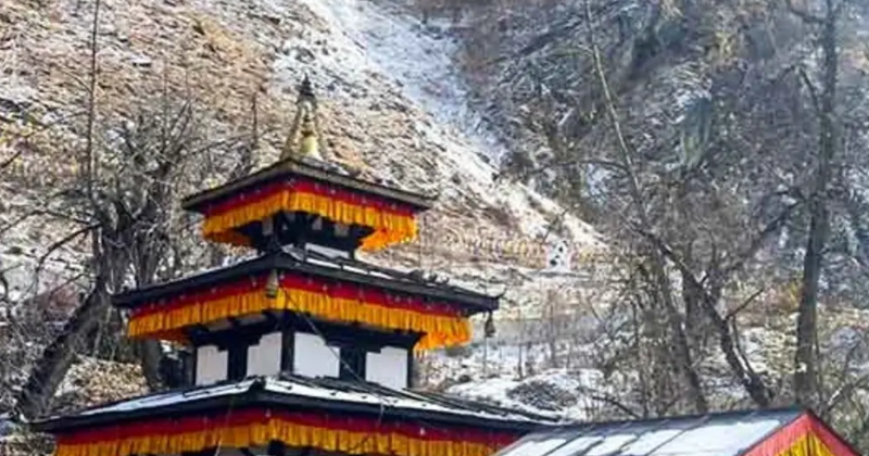 Muktinath temple complex surrounded by snowy hills during spring season