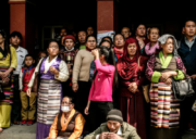 Sherpa community members gathered together wearing traditional Himalayan clothing
