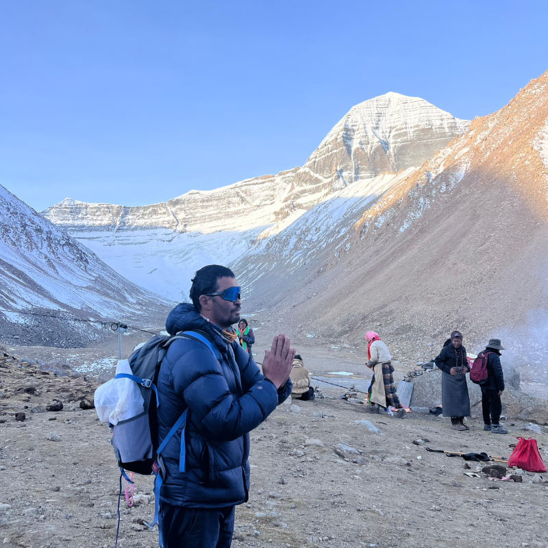 Mr. Tilak Shrestha offering prayers at Mount Kailash during the successful Kailash Kora and Kailash Parikrama 2026 on the way to Zuthulpuk with Mission Nepal Holidays.
