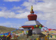 Yama Dwar shrine with colorful prayer flags on the Mount Kailash Kora trail in Tibet.