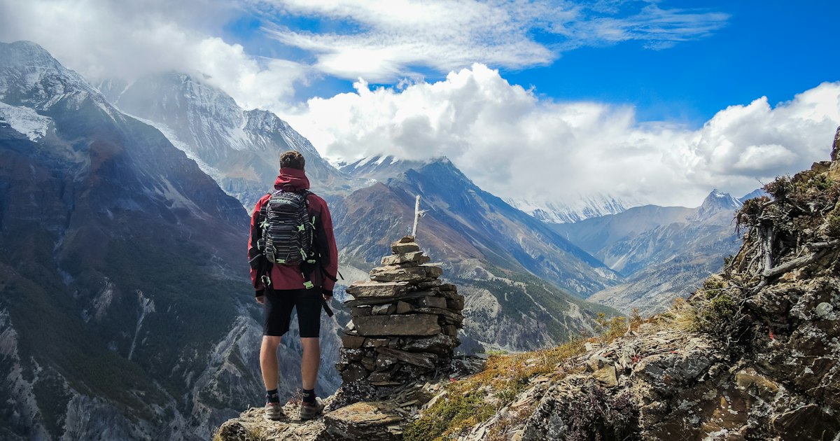 Snow-capped Himalayan peaks rising above a Nepal valley
